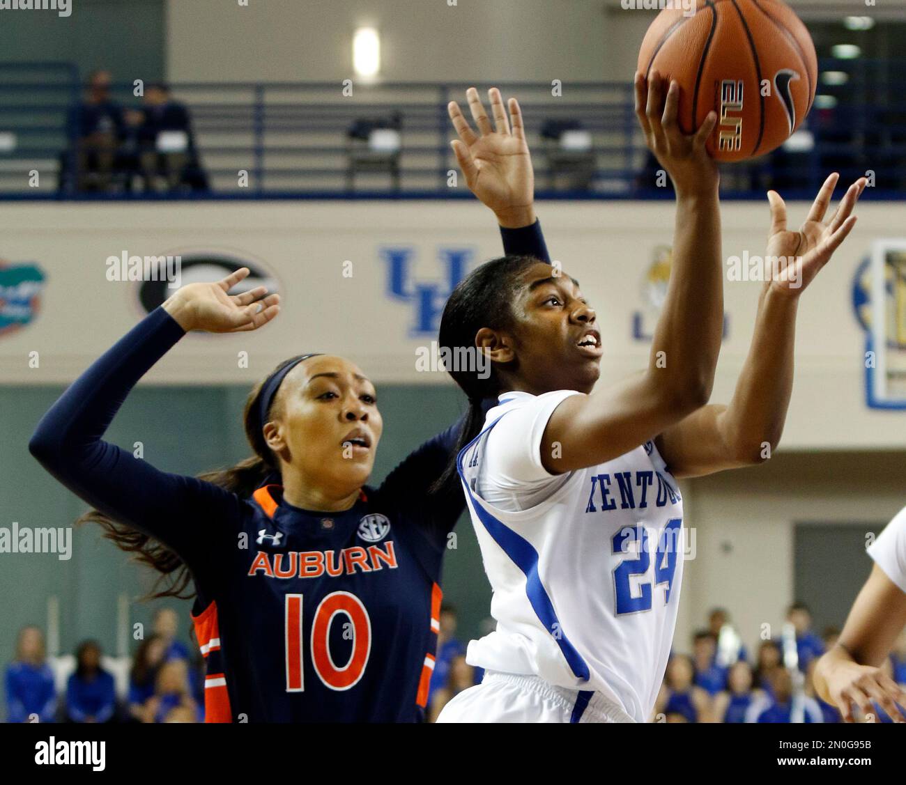Kentucky's Taylor Murray (24) shoots while defended by Auburn's Brandy Montgomery (10) during an