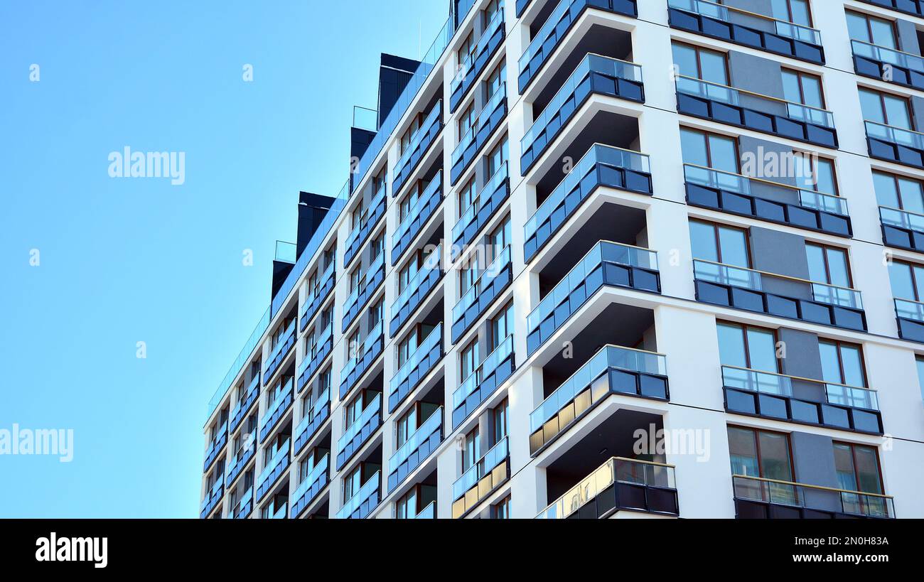 View of New apartment building with glass balconies. Modern architecture houses ...