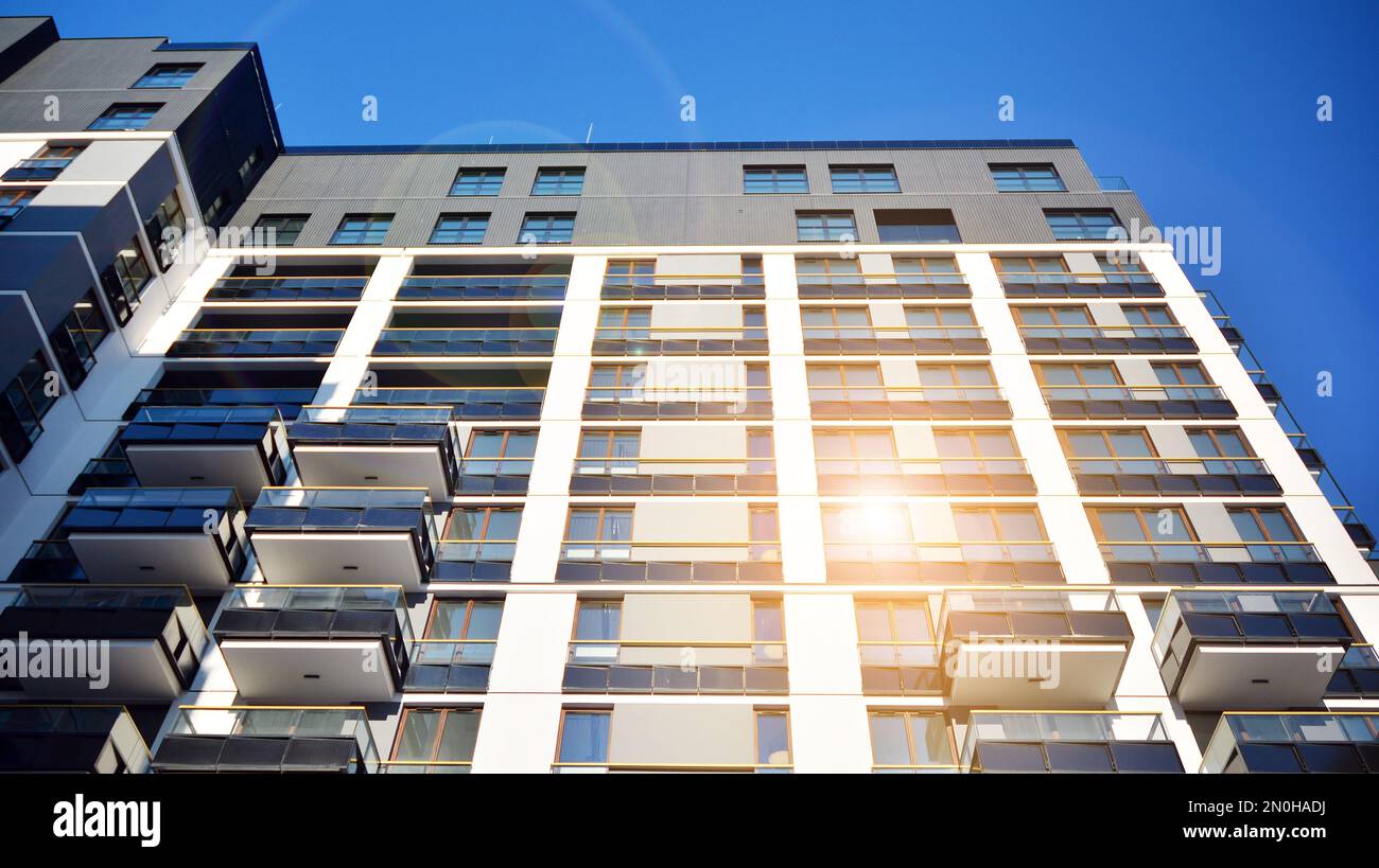 New apartment building with glass balconies. Modern architecture houses ...