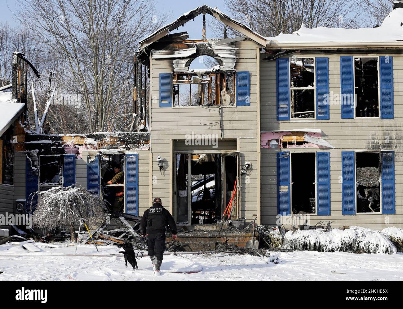 Investigators search a deadly house explosion, Tuesday, Jan. 12, 2016