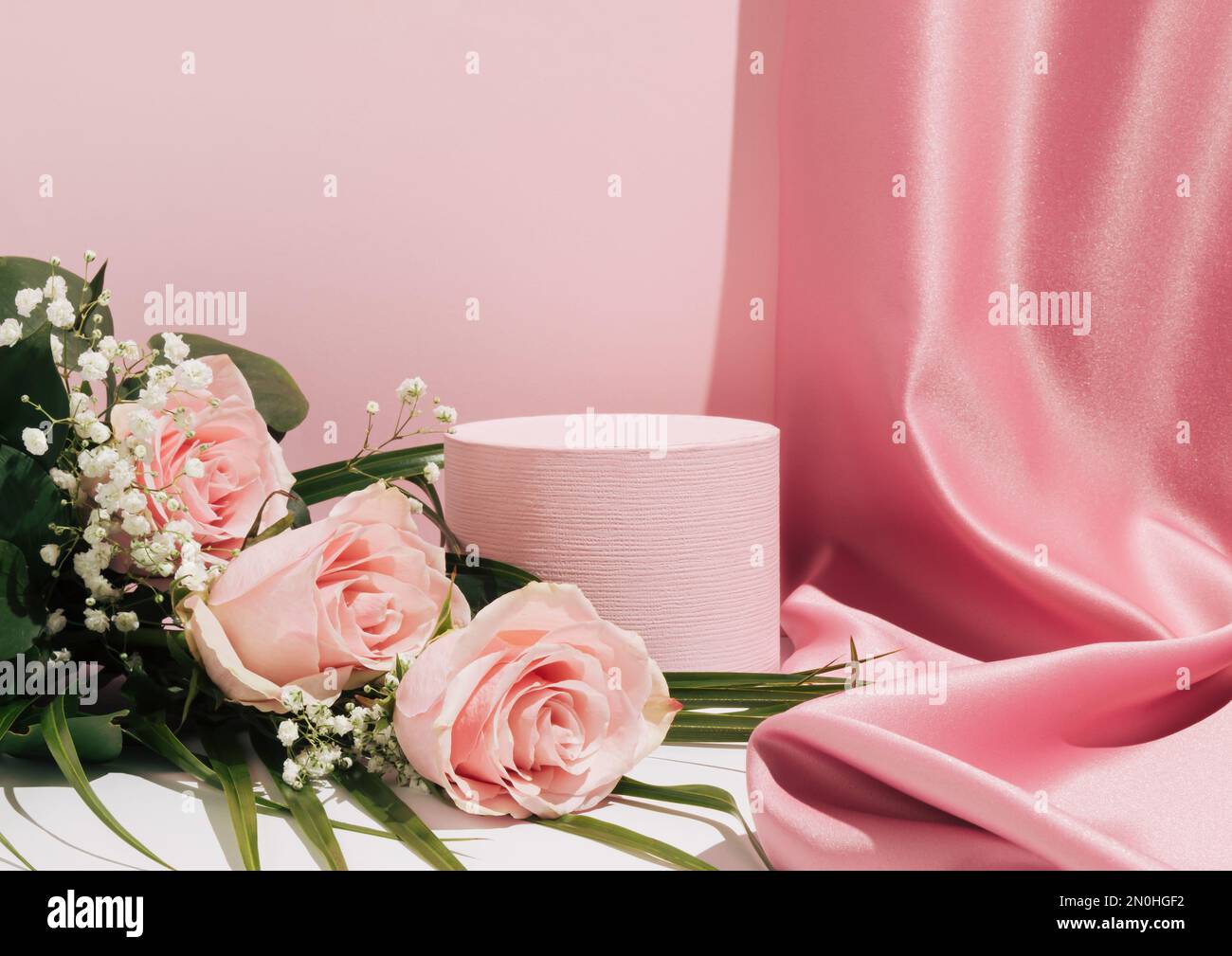 https://c8.alamy.com/comp/2N0HGF2/romantic-pastel-pink-composition-satin-curtain-and-bouquet-of-pink-roses-suitable-for-product-display-and-business-concept-modern-aesthetic-2N0HGF2.jpg