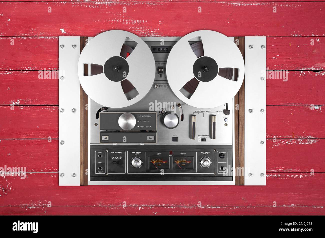 Vintage Music and sound - Retro reel to reel rack tapes recorder isolated  red wooden background Stock Photo - Alamy