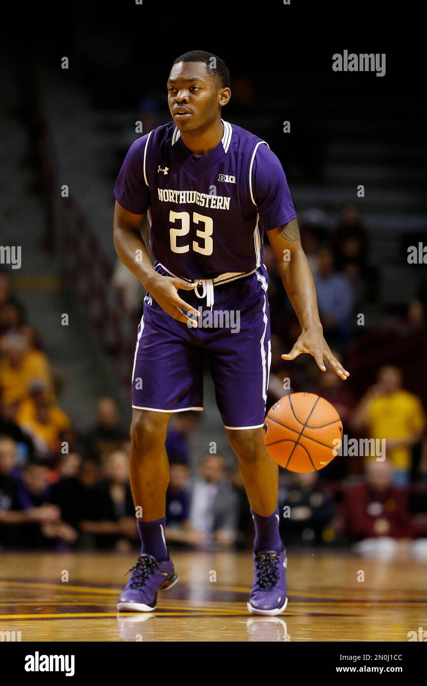 Northwestern guard Jordan Ash 23 controls the ball in the first