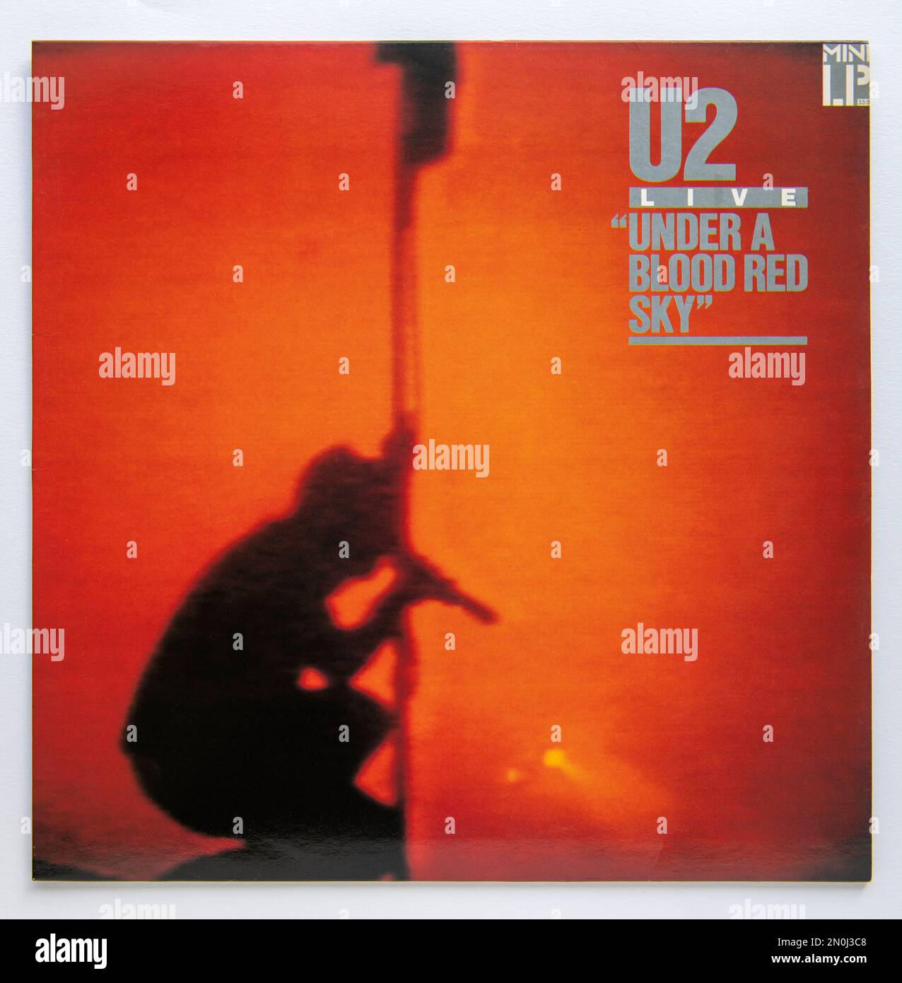 LP cover of Under a Blood Red Sky, a live album by Irish rock band U2, which was released in 1983 Stock Photo