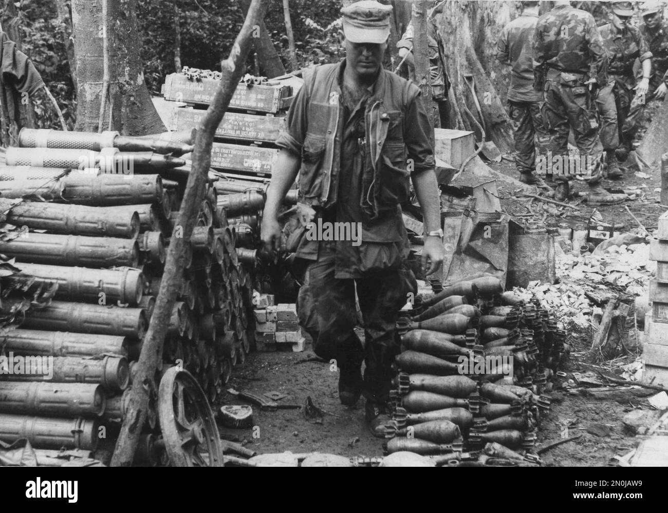 in-this-handout-from-the-us-marine-corps-sgt-william-l-lamb-of-wenatchee-wash-walks-along-thousands-of-rounds-of-ammunition-at-a-nva-bunker-complex-found-by-the-4th-marine-regiment-during-a-heliborne-sweep-between-the-dmz-and-the-former-us-base-at-khe-sanh-jan-3-1968-nearly-40000-rounds-of-small-arms-ammunition-2085-mortar-and-rocket-rounds-and-273-mines-and-grenades-were-discovered-ap-photous-marine-corps-2N0JAW9.jpg