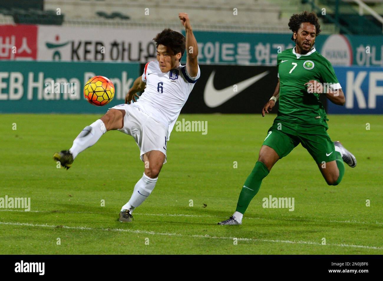 Sim Sangmin of South Korea attempts to kick the ball away from his goal  pressured by Abdulmajeed Alsulayhim of Saudi Arabia during a friendly match  in Dubai, the United Arab Emirates, Thursday,