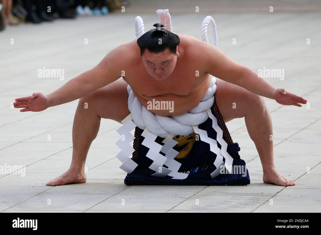 Sumo grand champion Hakuho of Mongolia performs his ring entry forms at ...