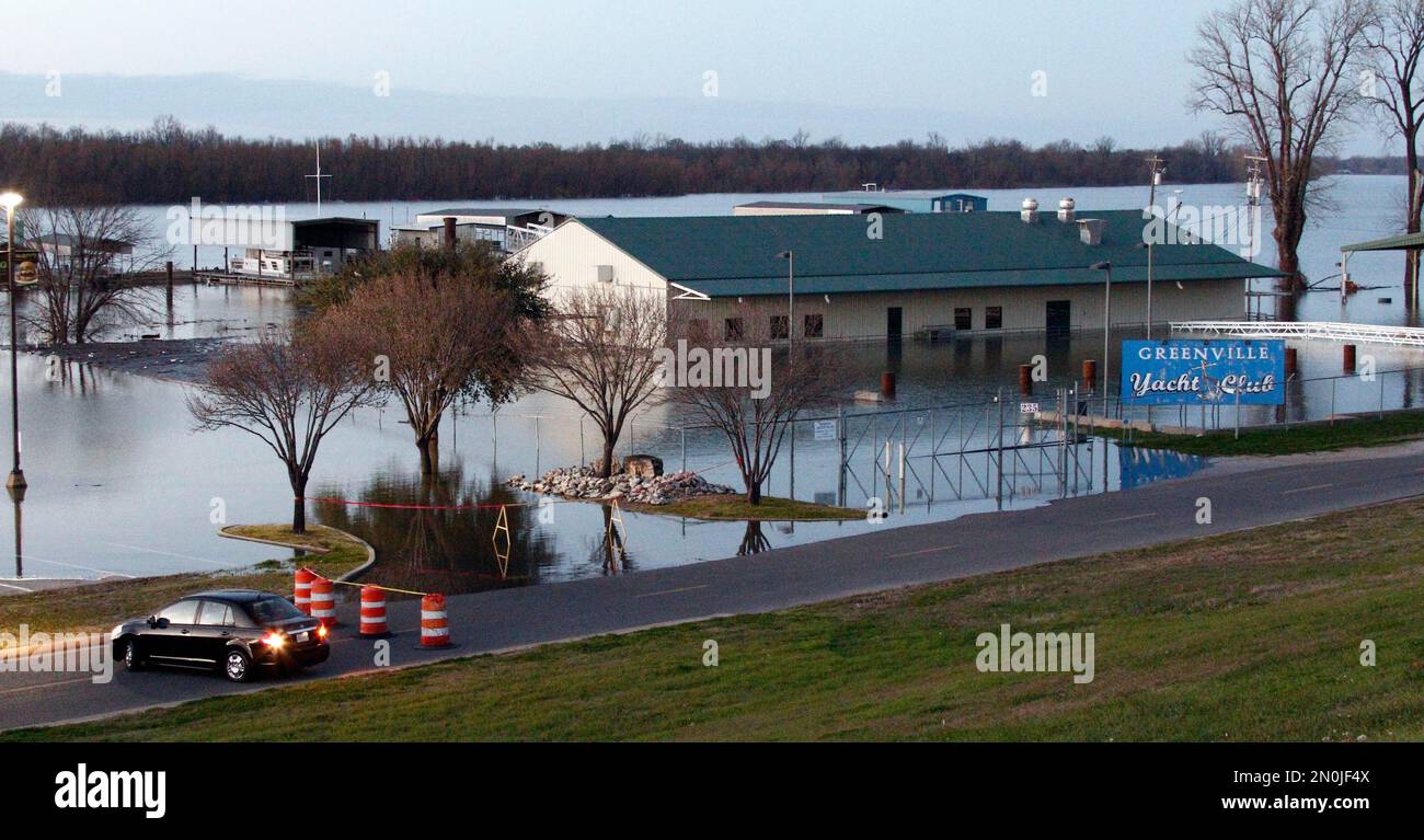 A vehicle backs up on the road leading to the Greenville Yacht Club