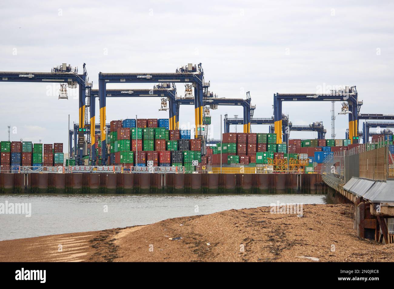 Typical steel shipping containers stacked up on Felixtowe docks, Suffolk, UK Stock Photo