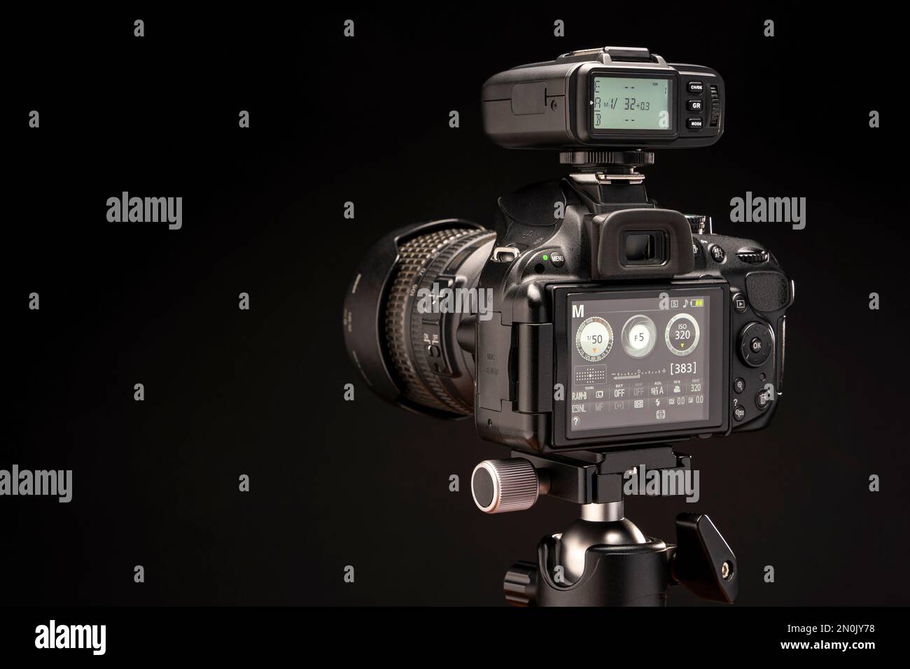 camera is turned on with a flash synchronizer on a black background ...