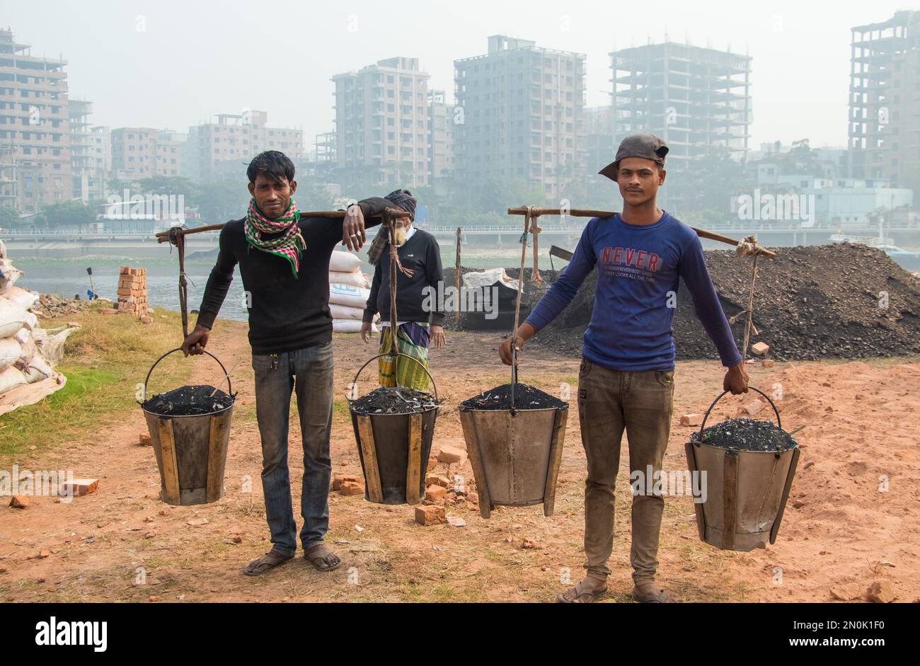People are working hard in the brick field. This image was taken from Bosela, Bangladesh on December 30, 2022 Stock Photo