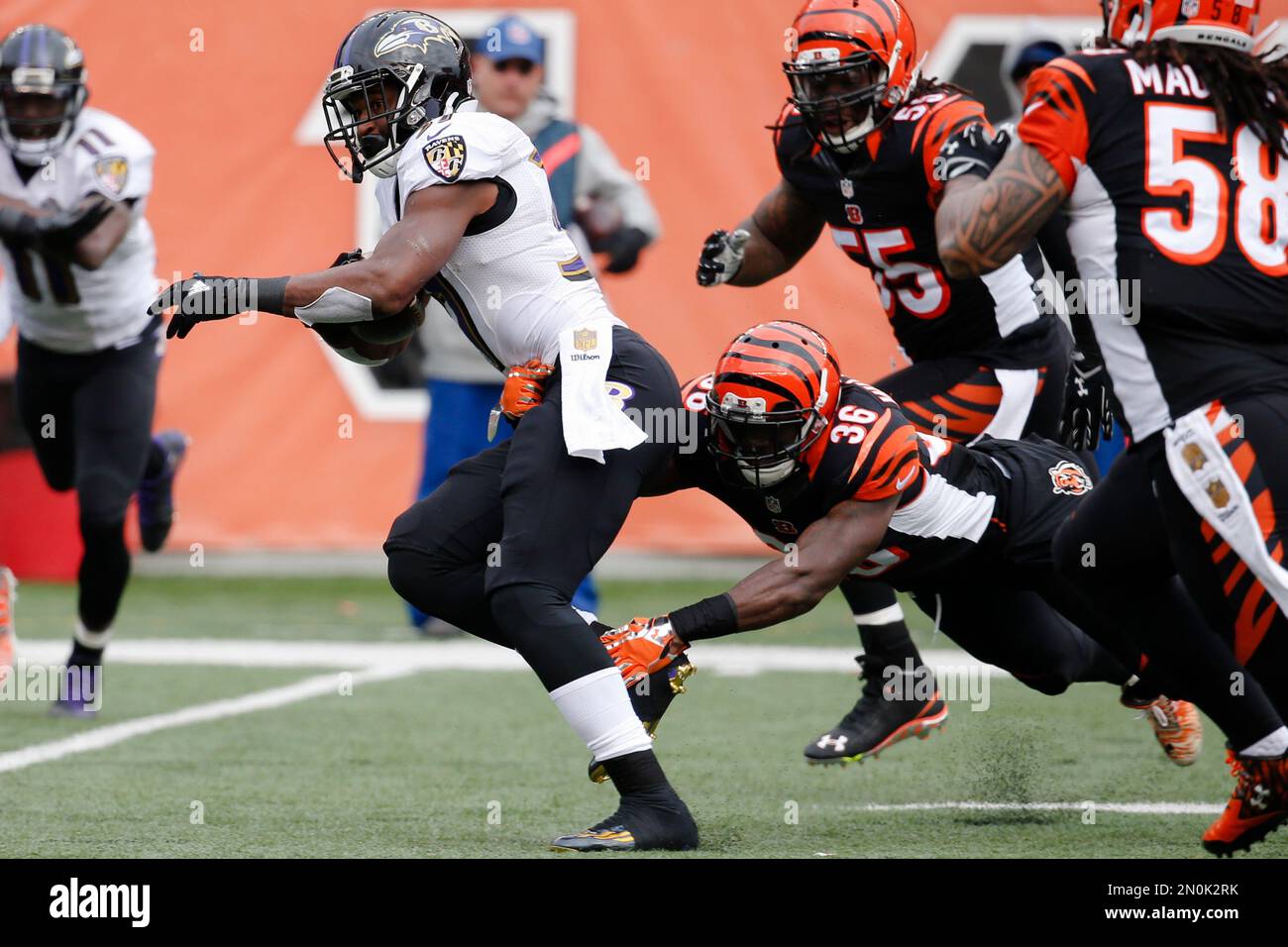 Baltimore Ravens running back Javorius Allen, front left, runs the ball