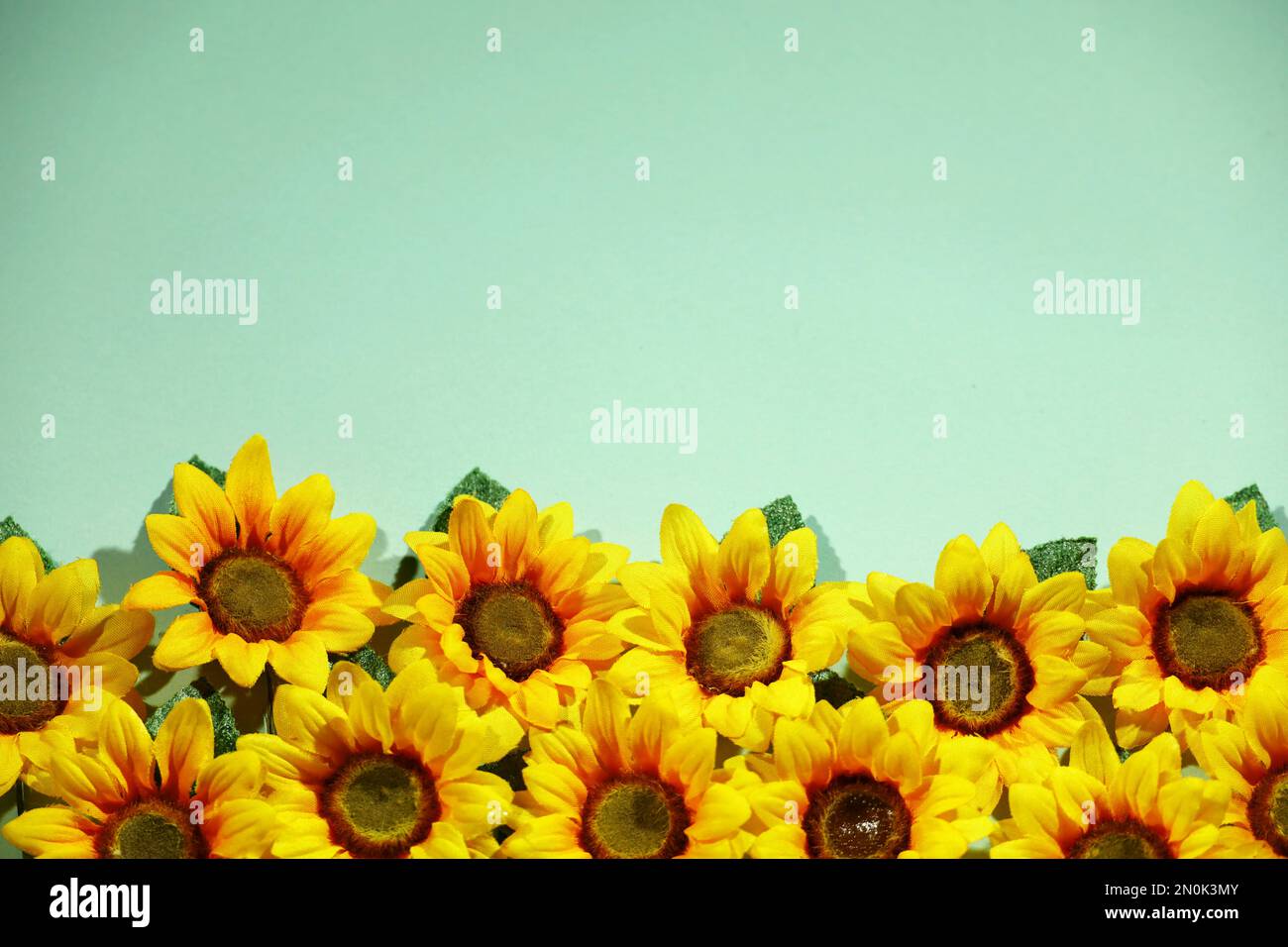 sunflower artificial flower background material picture in blue space Stock Photo