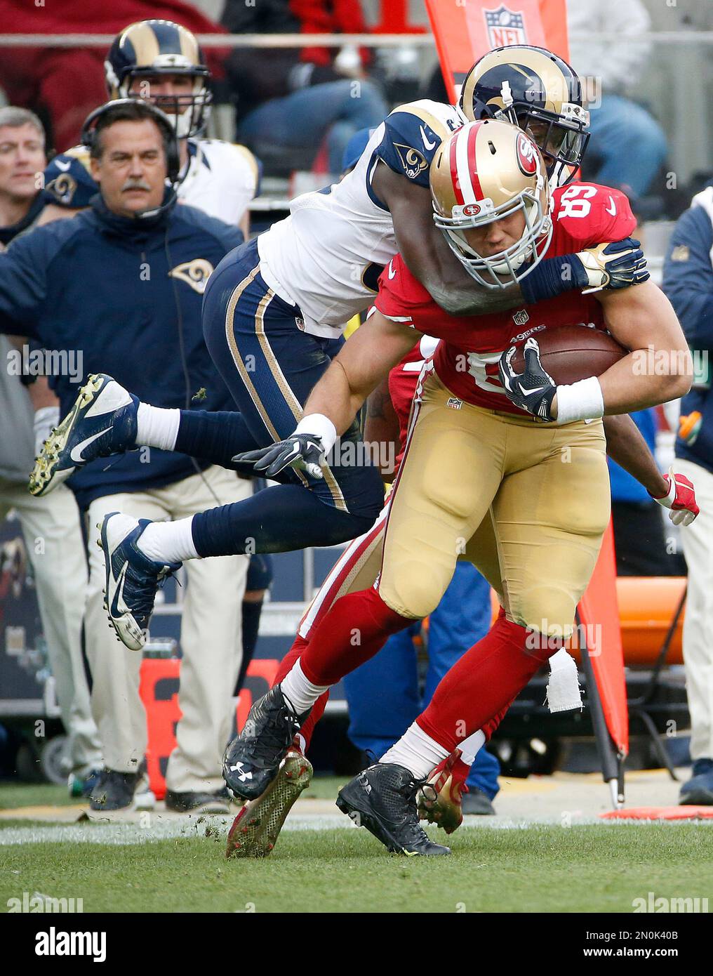 St. Louis Rams strong safety Maurice Alexander, top, tackles San