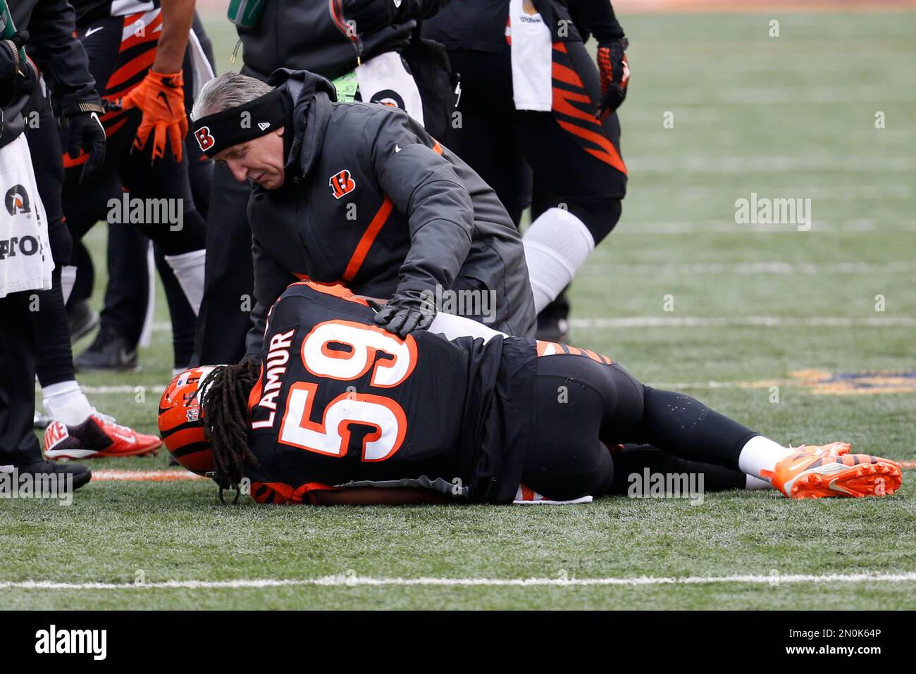 Cincinnati Bengals outside linebacker Emmanuel Lamur (59) sits on the field  injured in the first half of an NFL football game against the Baltimore  Ravens, Sunday, Jan. 3, 2016, in Cincinnati. (AP