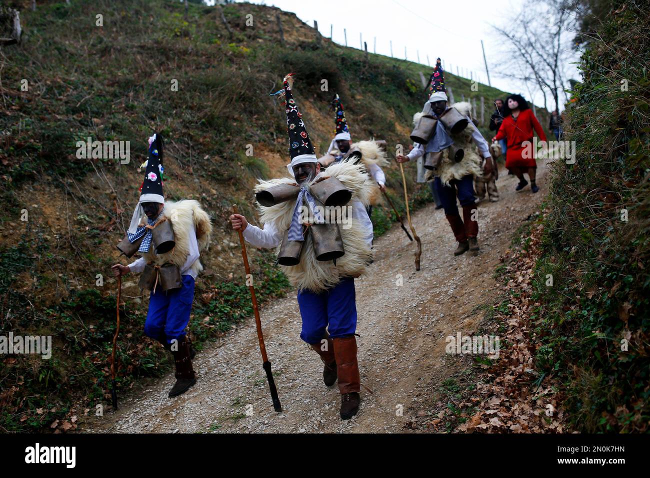 men-dressed-in-sheepskins-and-jingling-bells-to-make-noise-and-so