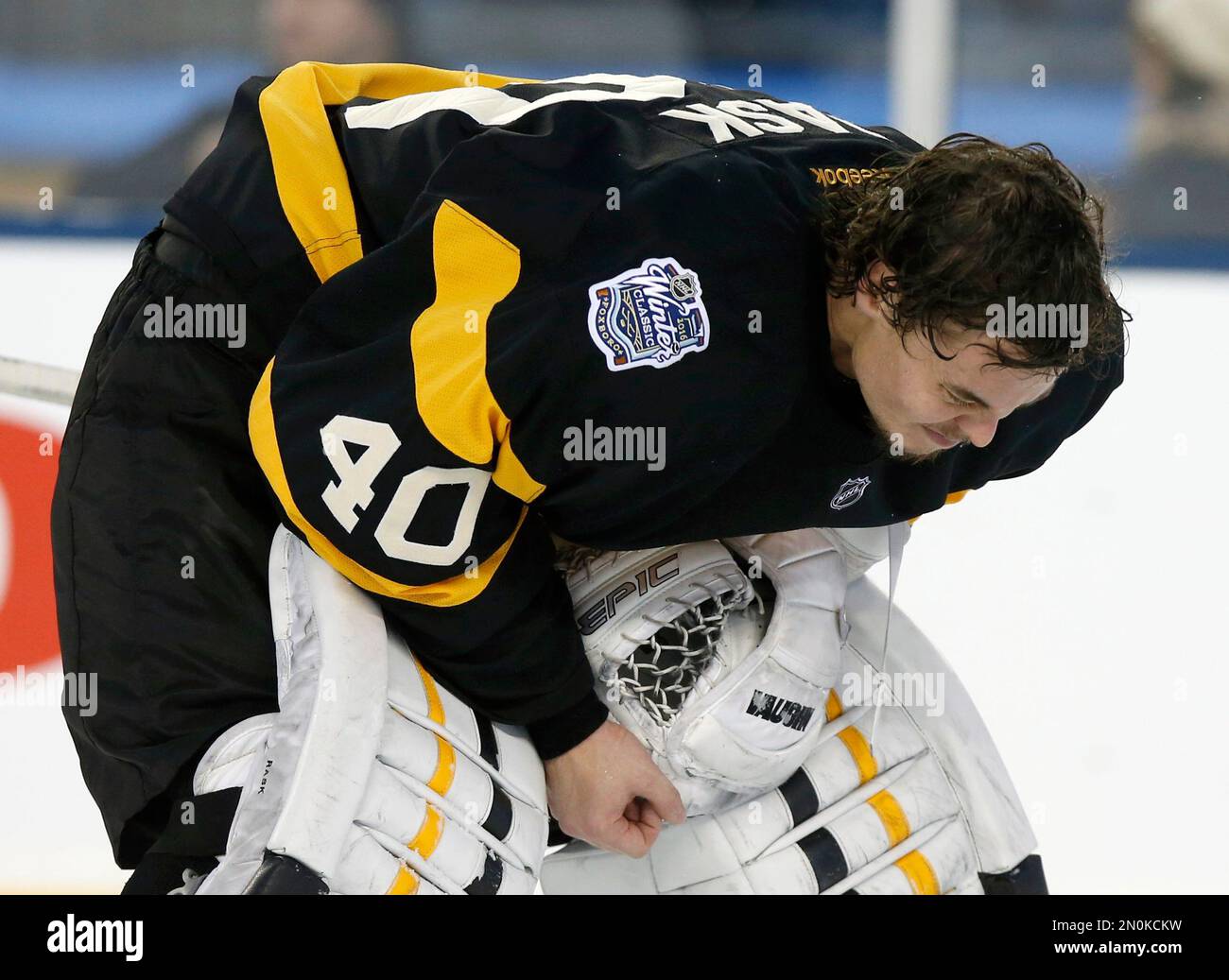 Boston Bruins Tuukka Rask skates back to the net after taking a hit during the third period of the NHL Winter Classic hockey game against the Montreal Canadiens at Gillette Stadium in