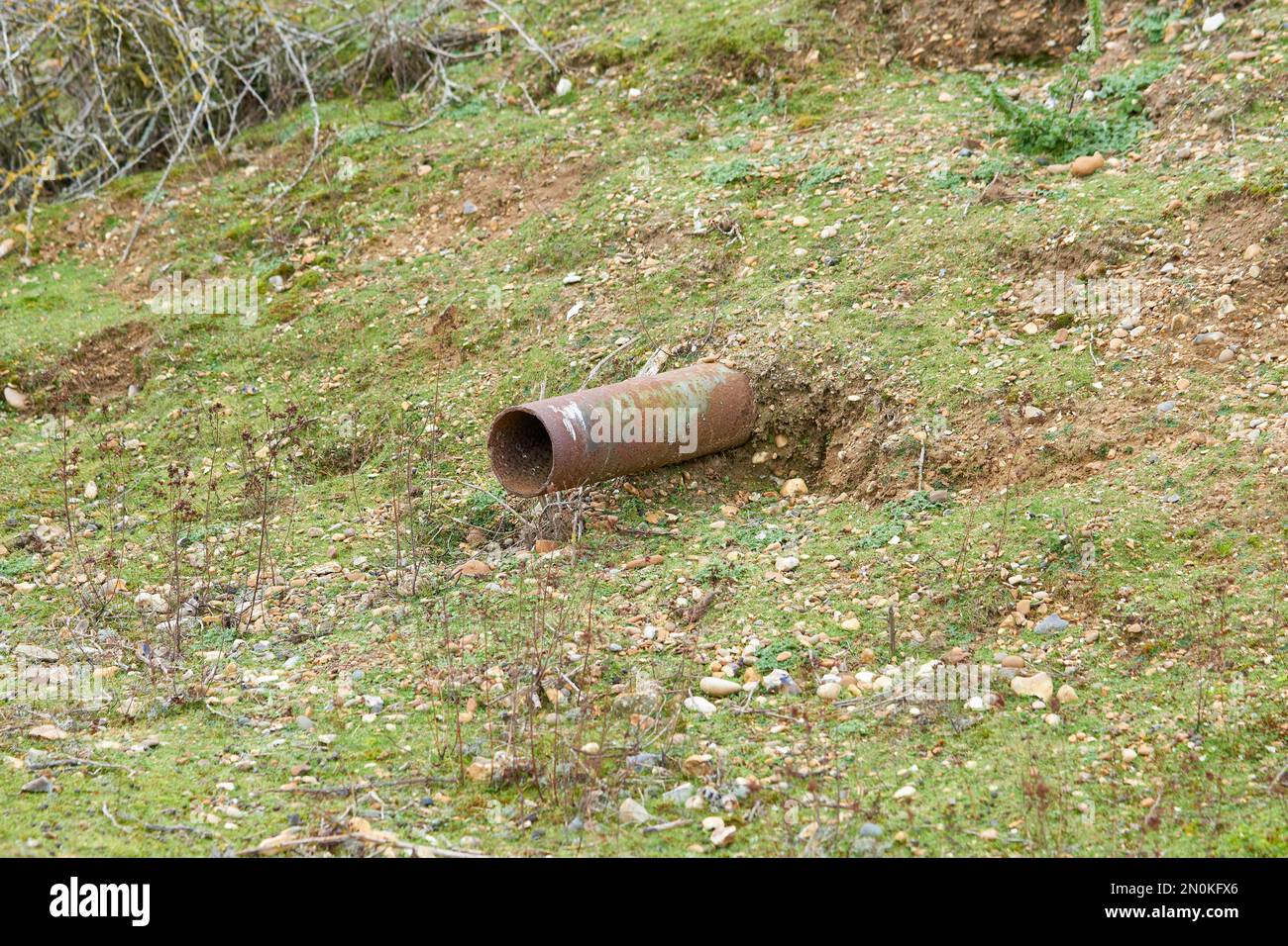 Rusty pipe sticking out of the ground Stock Photo Alamy
