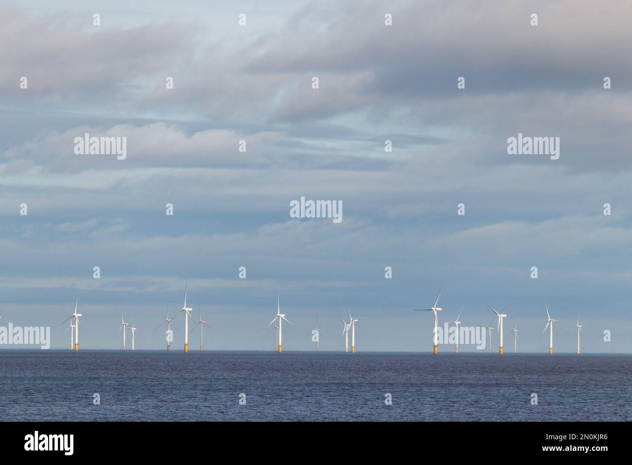 A wind turbine farm situated in the sea near Skegness, UK. Stock Photo