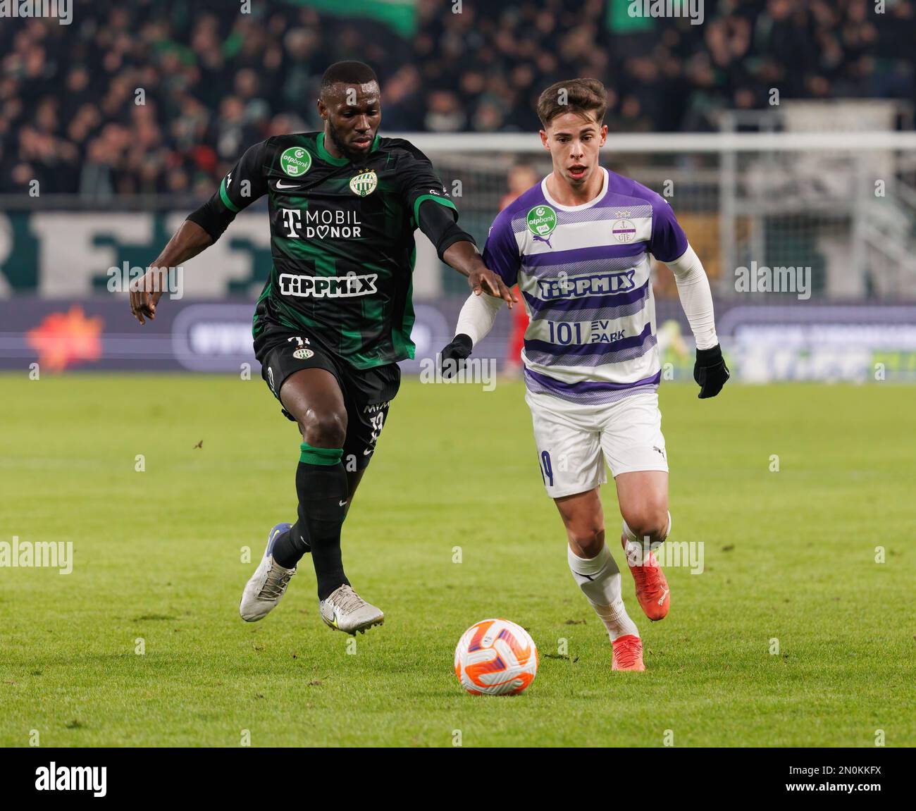 BUDAPEST, HUNGARY - MAY 27: (r-l) Endre Botka of Ferencvarosi TC challenges  Krisztian Simon of Ujpest FC during the Hungarian OTP Bank Liga match  between Ujpest FC and Ferencvarosi TC at Ferenc