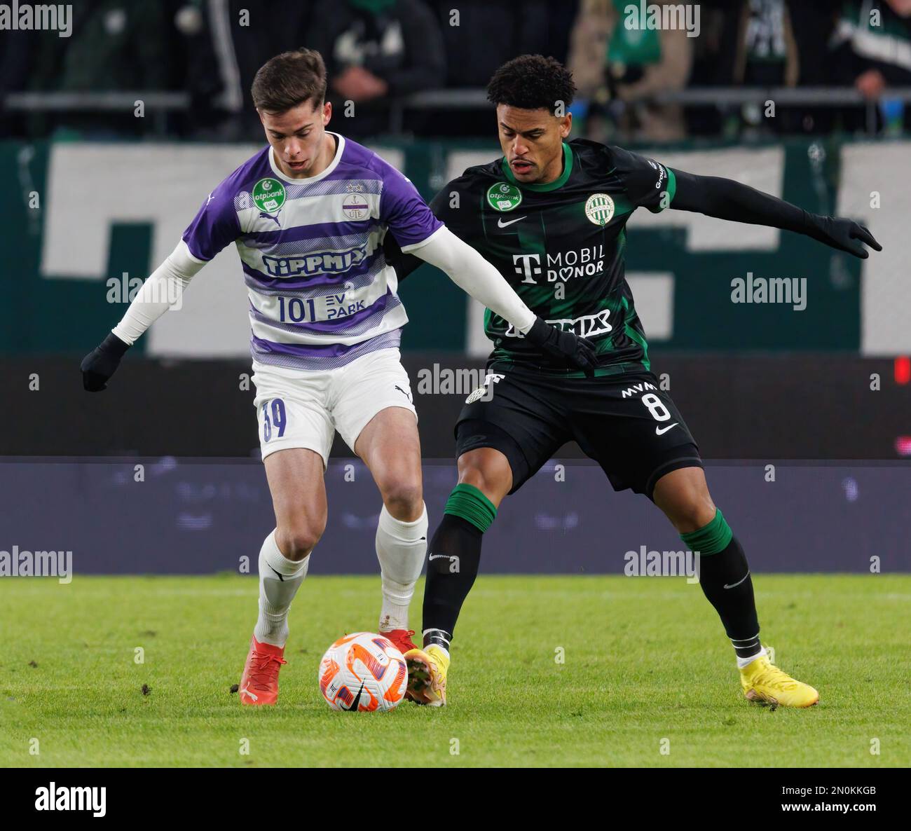 BUDAPEST, HUNGARY - MAY 27: (r-l) Endre Botka of Ferencvarosi TC challenges  Krisztian Simon of Ujpest FC during the Hungarian OTP Bank Liga match  between Ujpest FC and Ferencvarosi TC at Ferenc