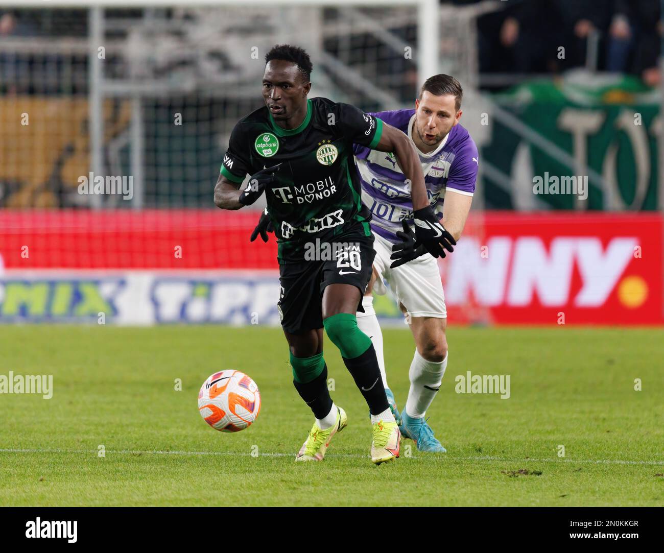 Mats Knoester of Ferencvarosi TC competes for the ball with