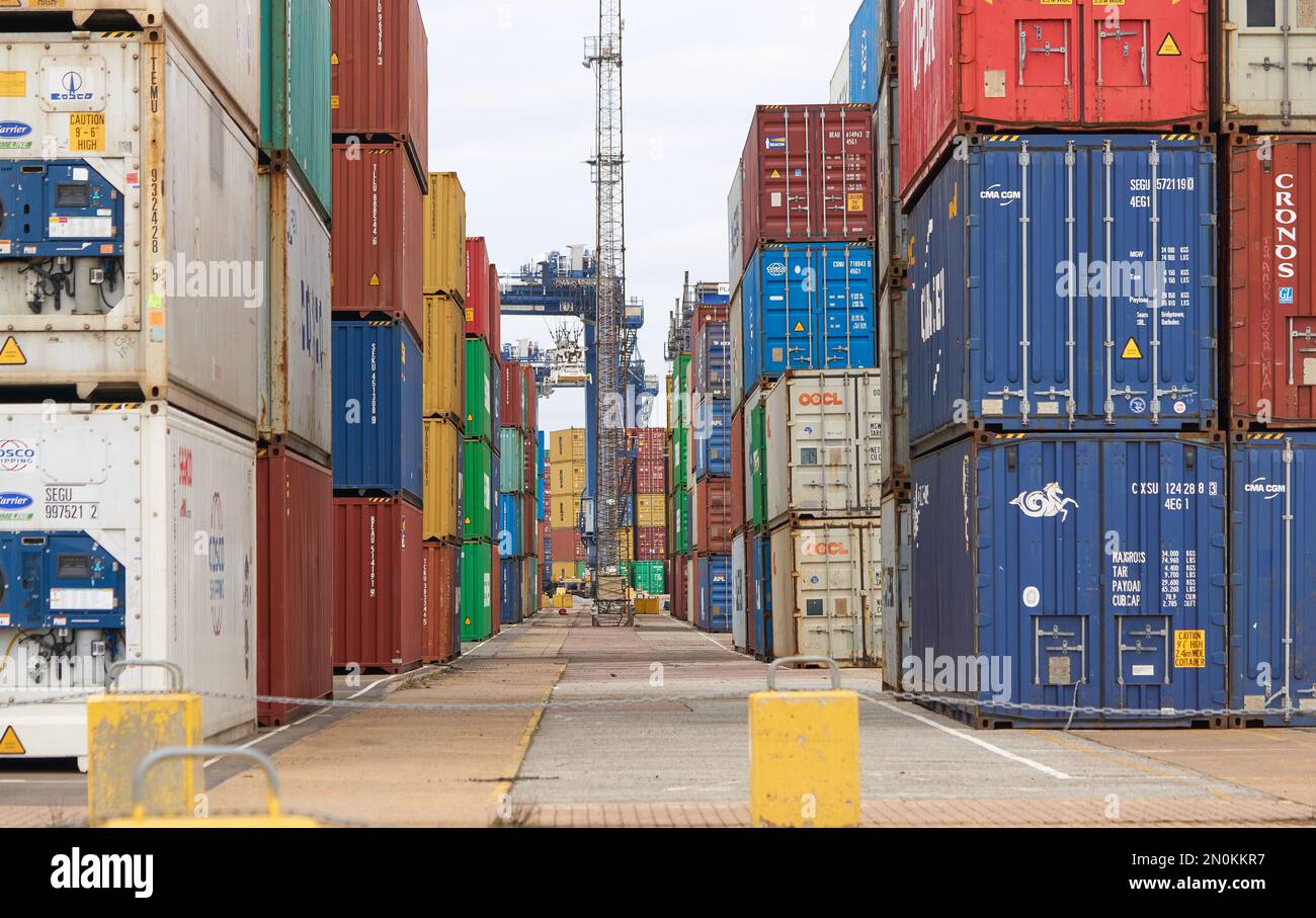 Typical steel shipping containers stacked up on Felixstowe docks, Suffolk, UK Stock Photo