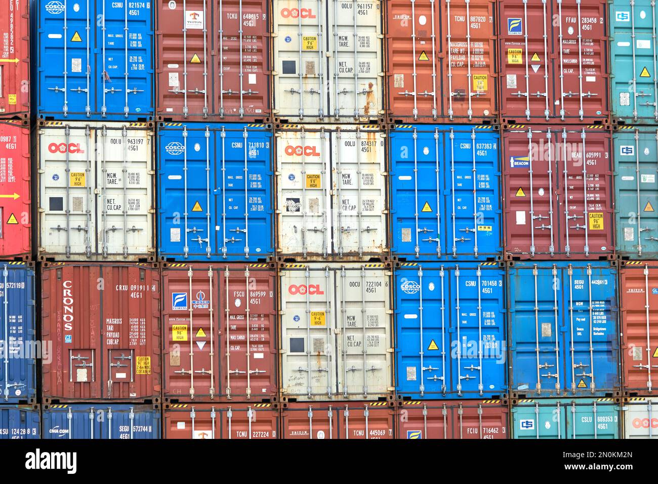 Typical steel shipping containers stacked up on Felixstowe docks, Suffolk, UK Stock Photo