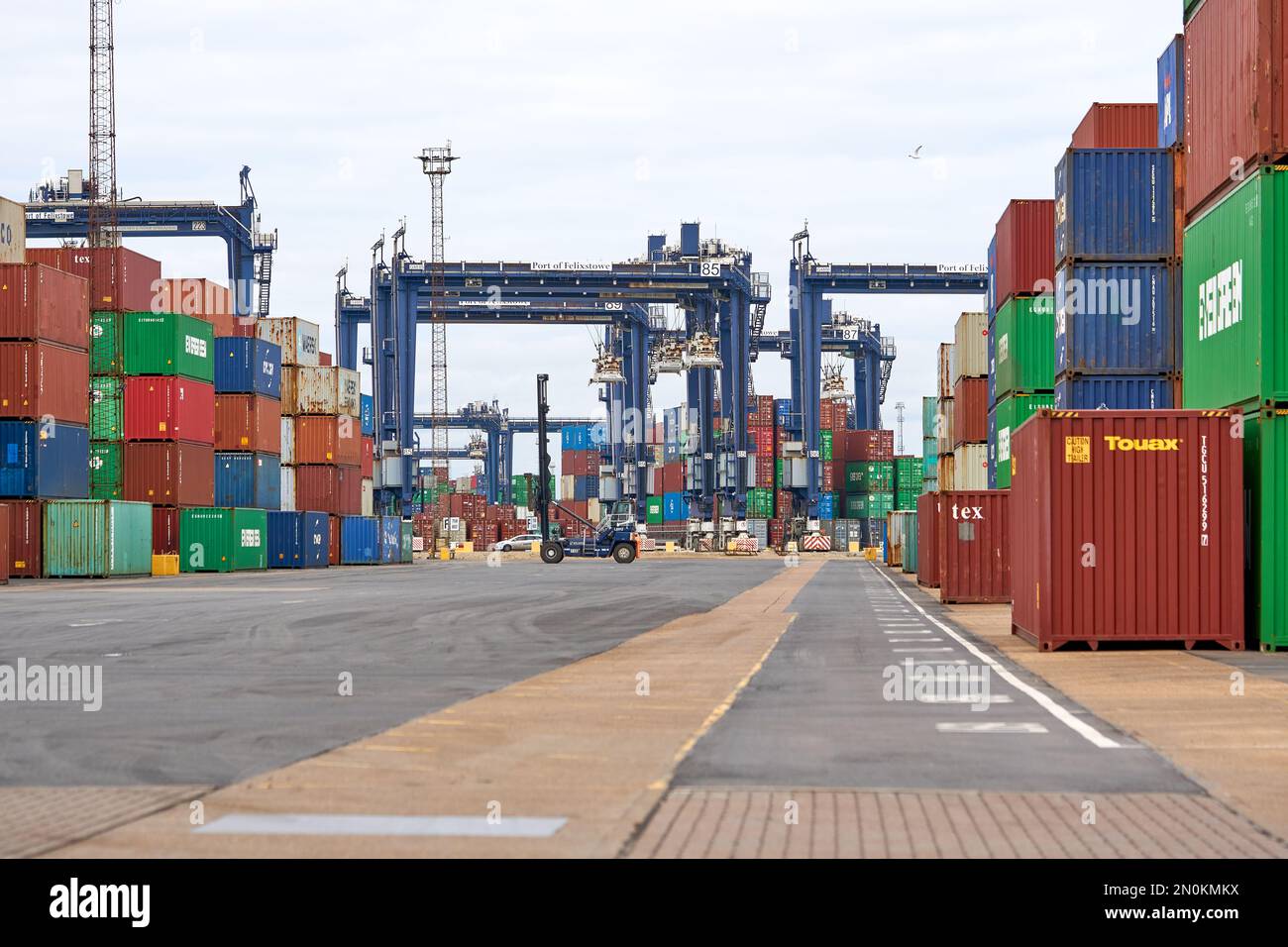 Typical steel shipping containers stacked up on Felixstowe docks, Suffolk, UK Stock Photo