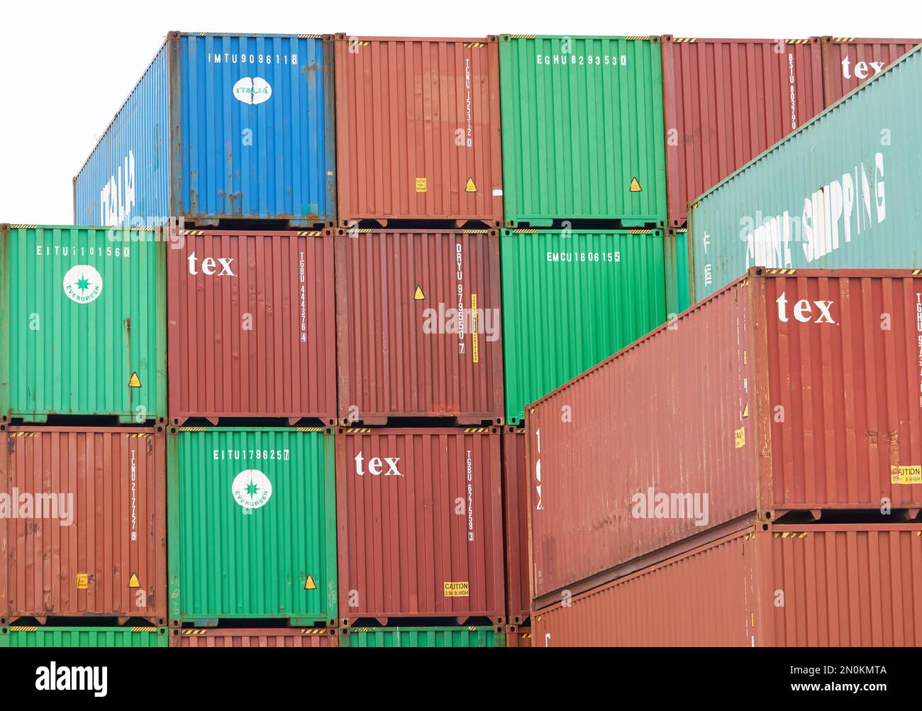 Typical steel shipping containers stacked up on Felixstowe docks, Suffolk, UK Stock Photo