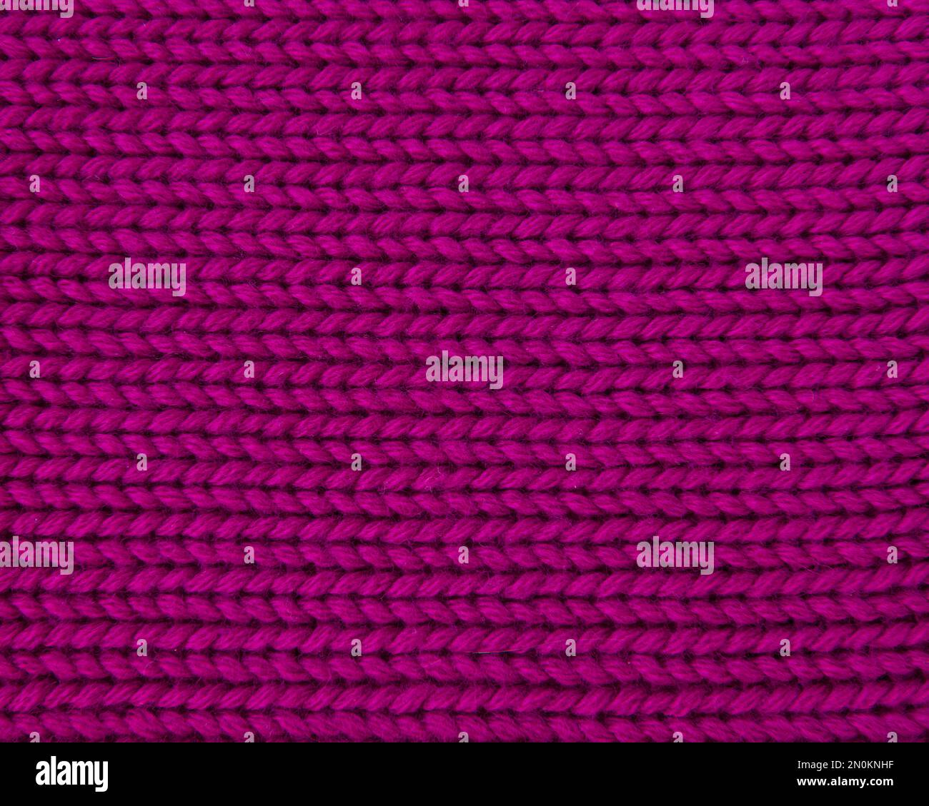 Woolen pink knitted warm texture fabric background Stock Photo