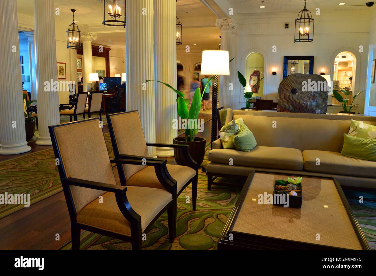 The lobby of the historic Moana Surfrider Hotel, on Waikiki Beach, gives a look at classic, luxury inn on Hawaii Stock Photo