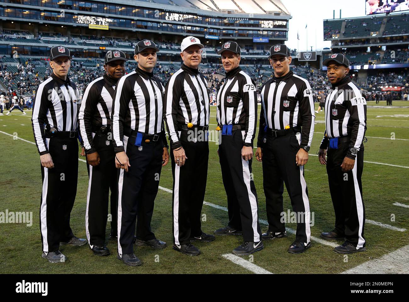 NFL side judge Scott Novak, from left, umpire Undrey Wash, field judge