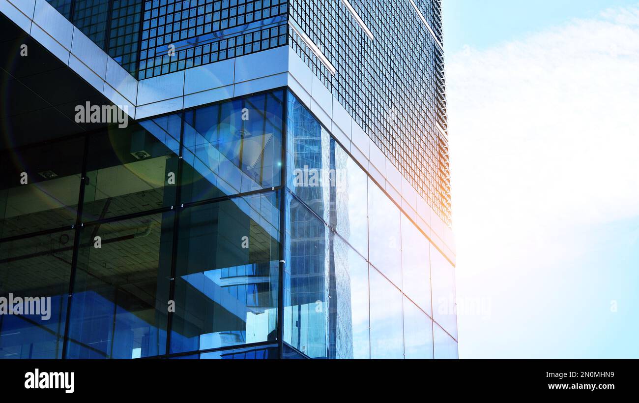 Modern office building with glass facade on a clear sky background ...