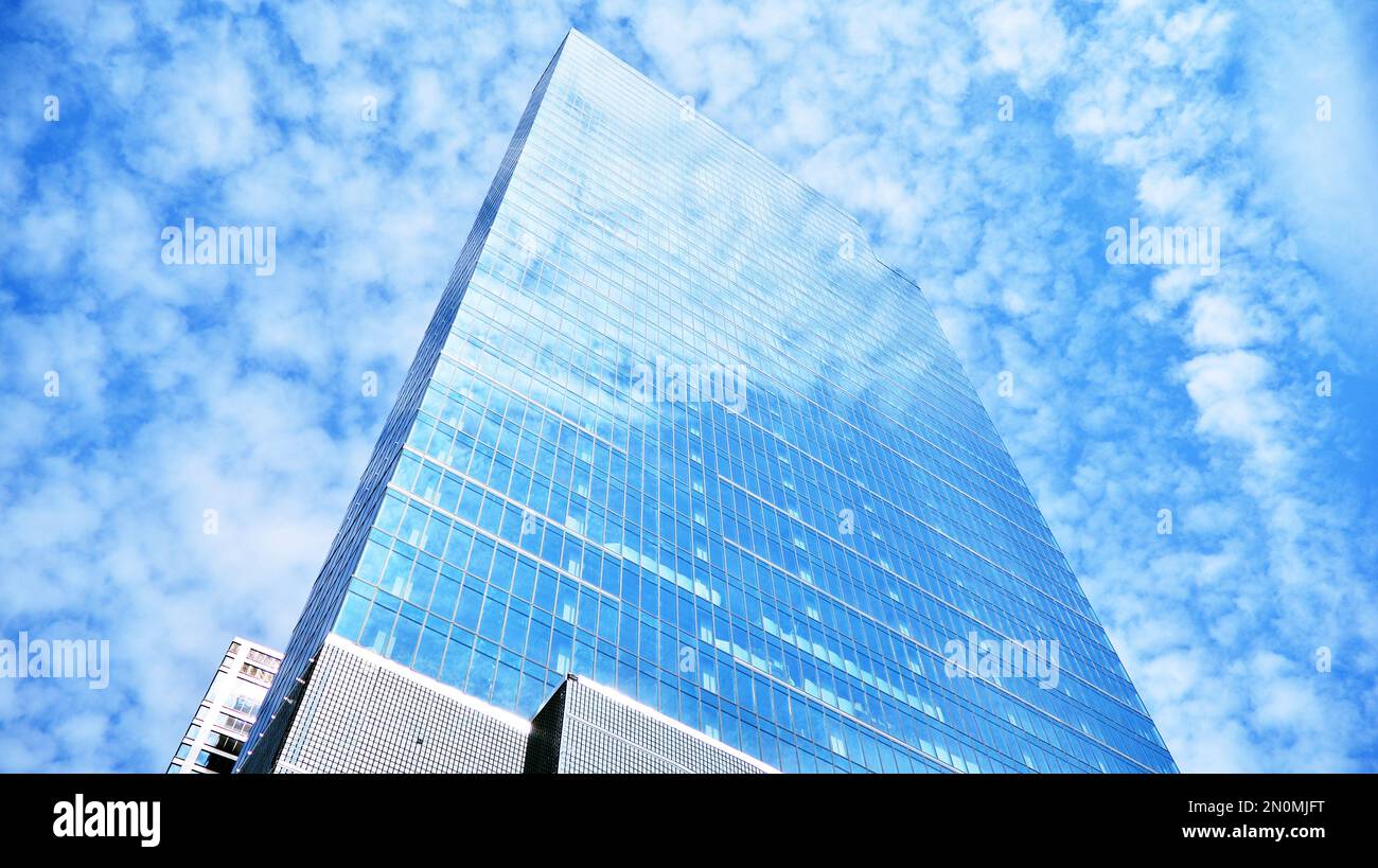 Modern office building with glass facade on a clear sky background ...