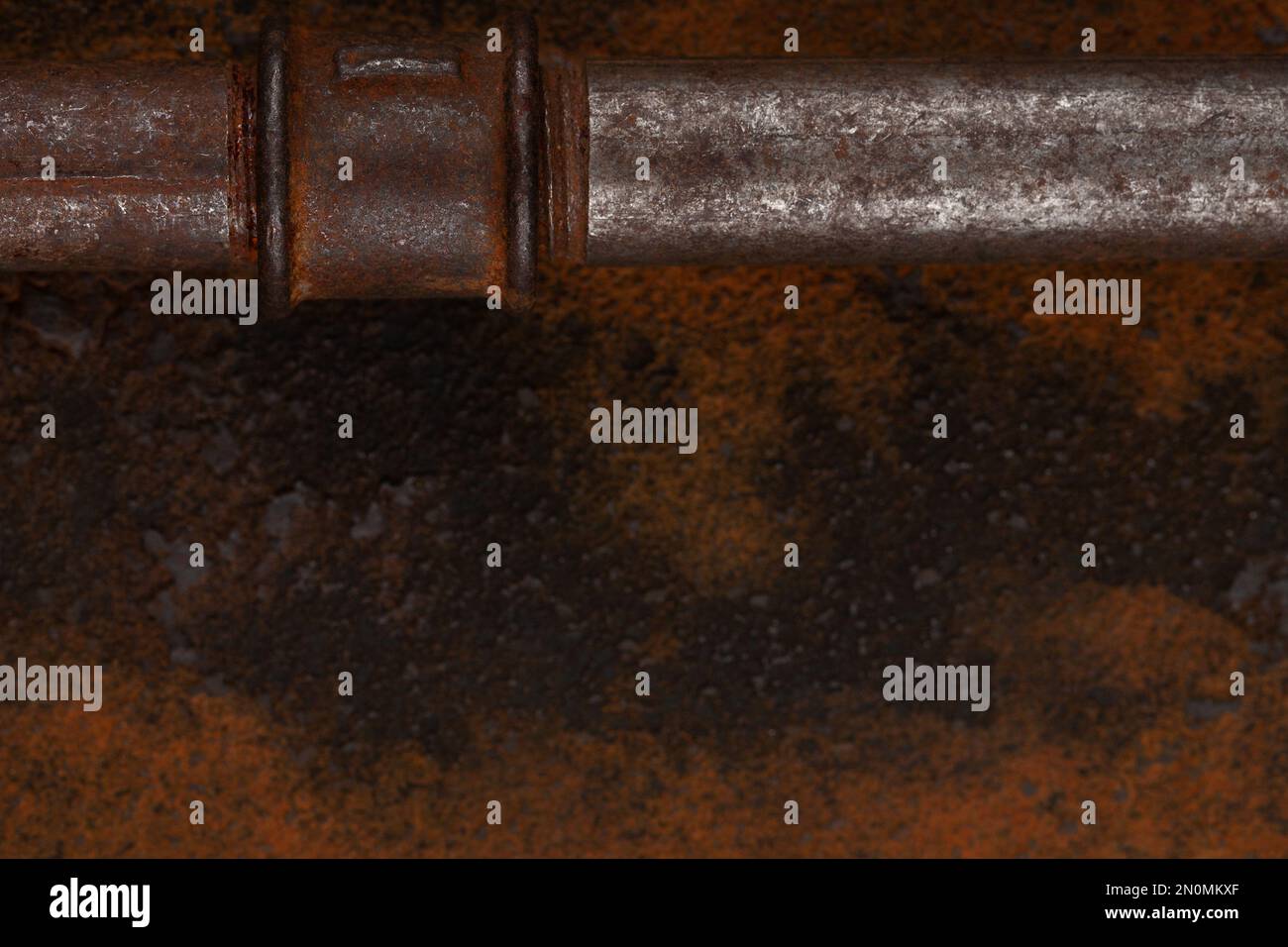 Old rusty valve pipes on rusty metal wall background Stock Photo - Alamy