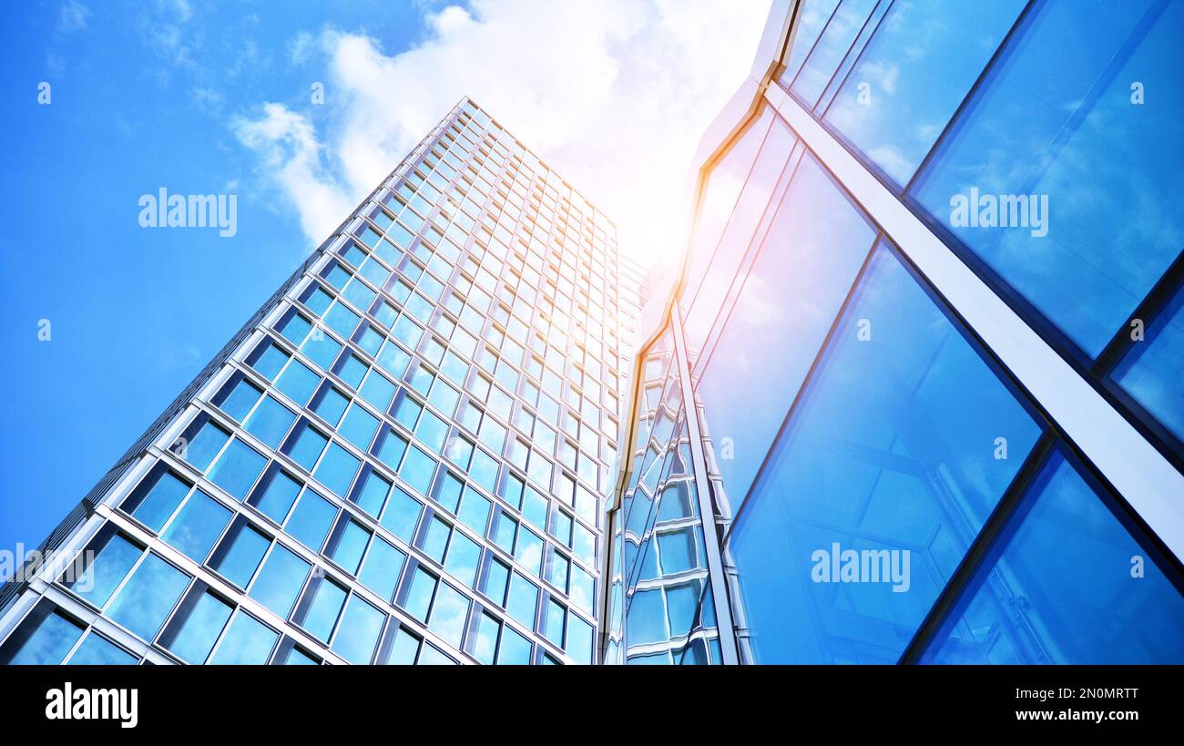 Modern office building with glass facade on a clear sky background ...