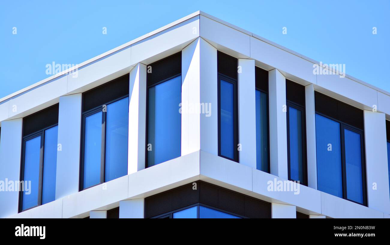 Office building with white aluminum composite panels. Facade wall made of glass and metal. Abstract modern business architecture. Stock Photo