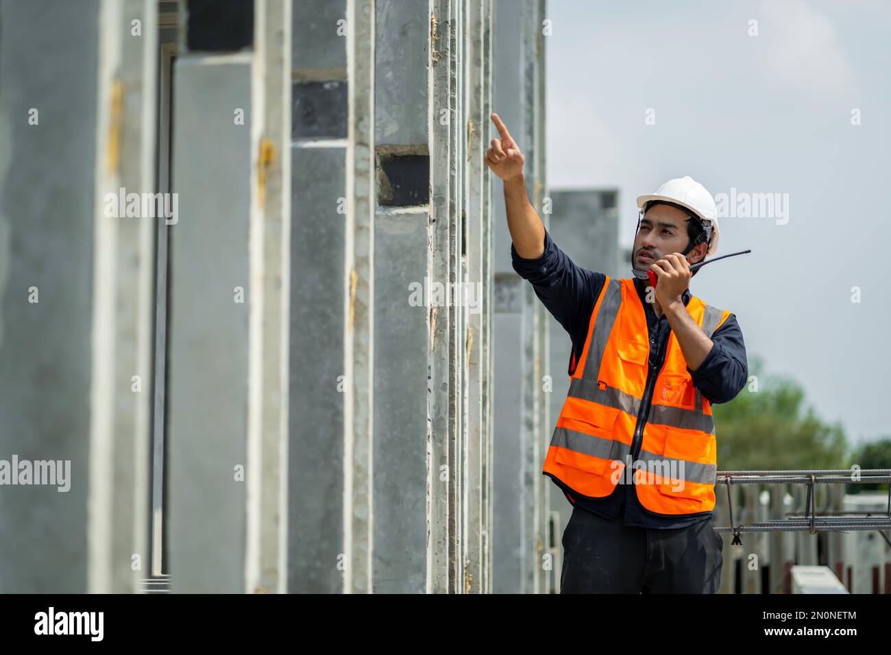 Someone Inspecting Male engineers are inspecting and controlling the work of the employees ...