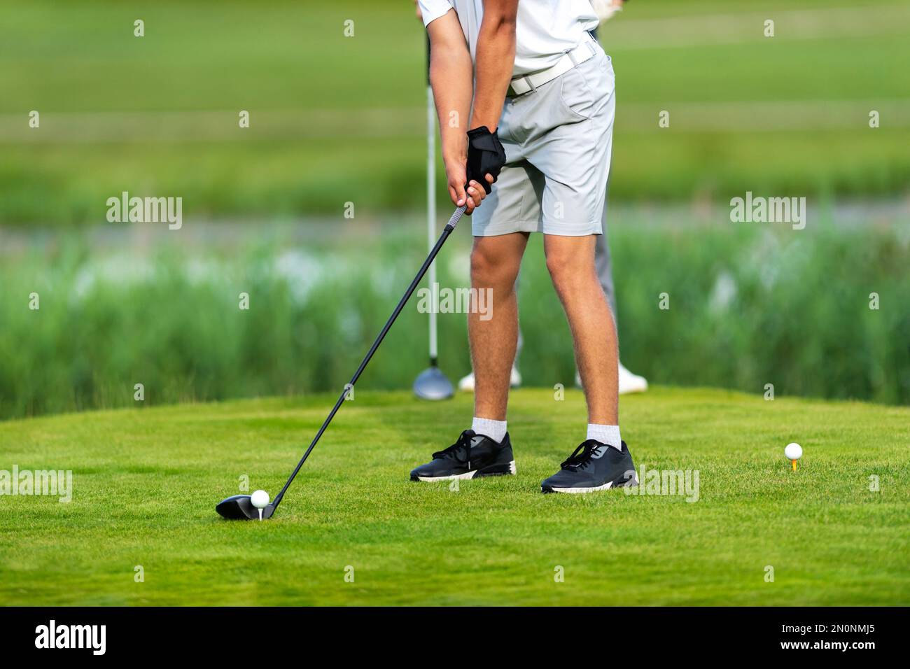 Professional golf player in action. Horizontal sport and golf club, course theme poster, greeting cards, headers, website and app Stock Photo