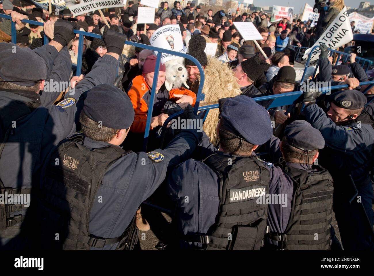 Shepherds push fences as they charge to the parliament building during ...