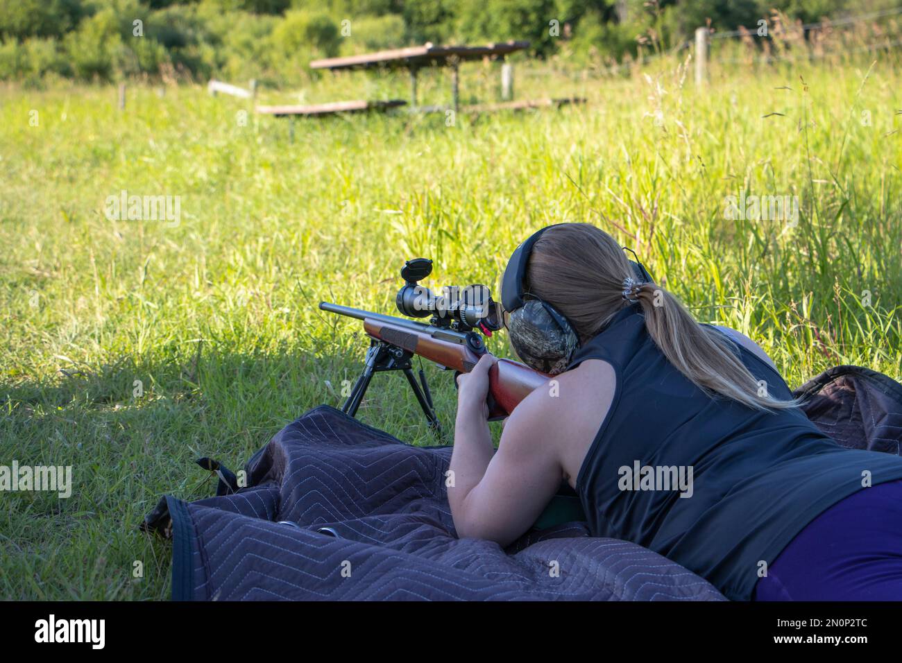 female with gun target shooting Stock Photo Alamy