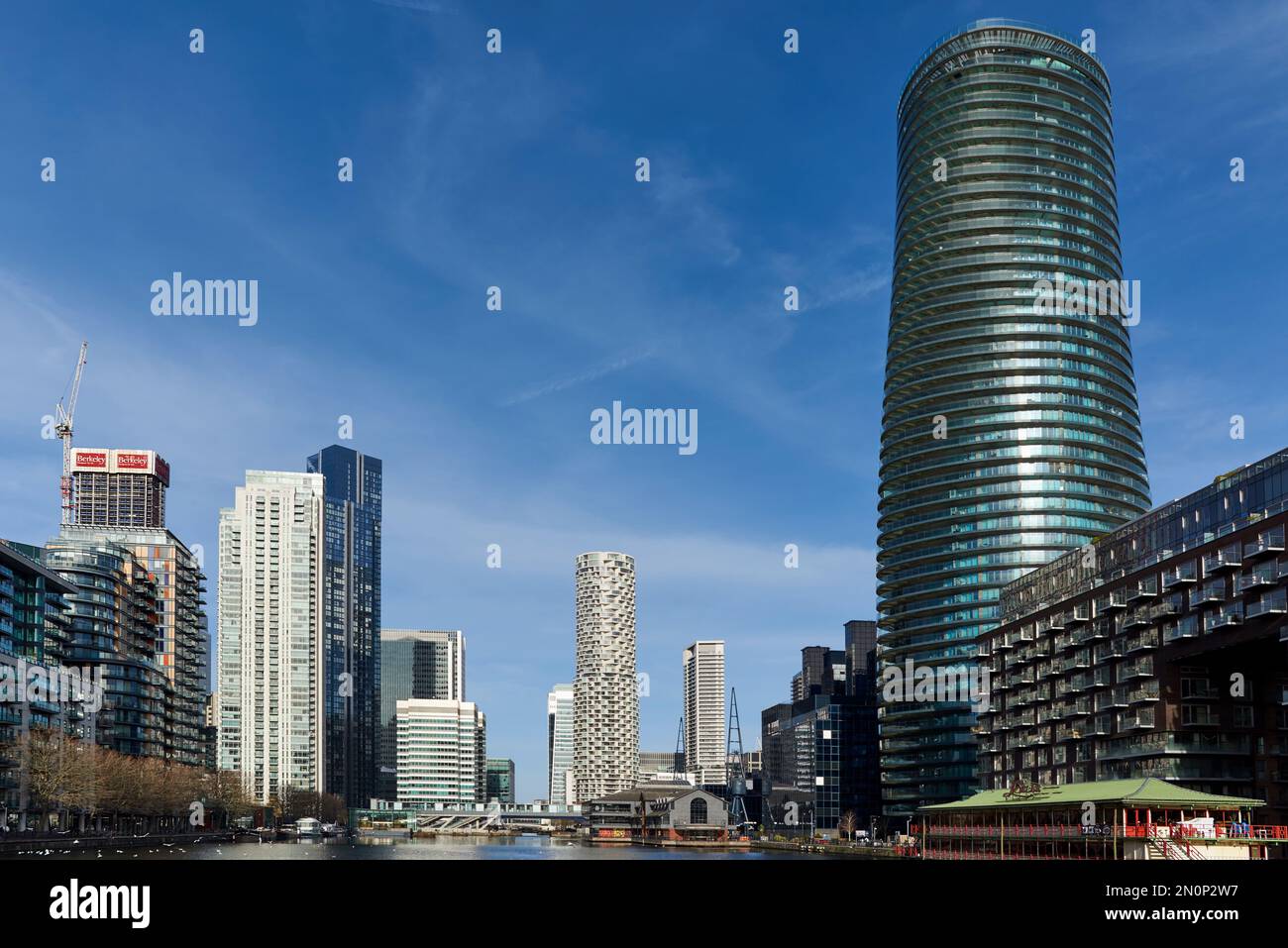 The Arena Tower and other buildings at Millwall Inner Dock, London Docklands UK, looking north towards South Quay Stock Photo