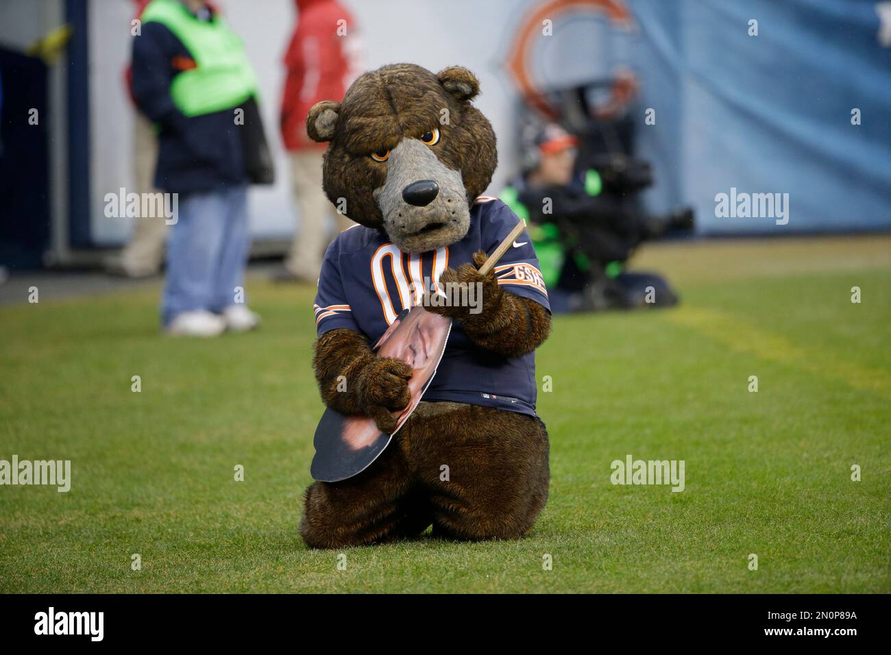 Service members take photos with Staley Da Bear, the Chicago Bears mascot  during the Chicago Bears Salute to Service game Nov. 27 at Soldier Field,  in Chicago. Nearly 100 personnel from all