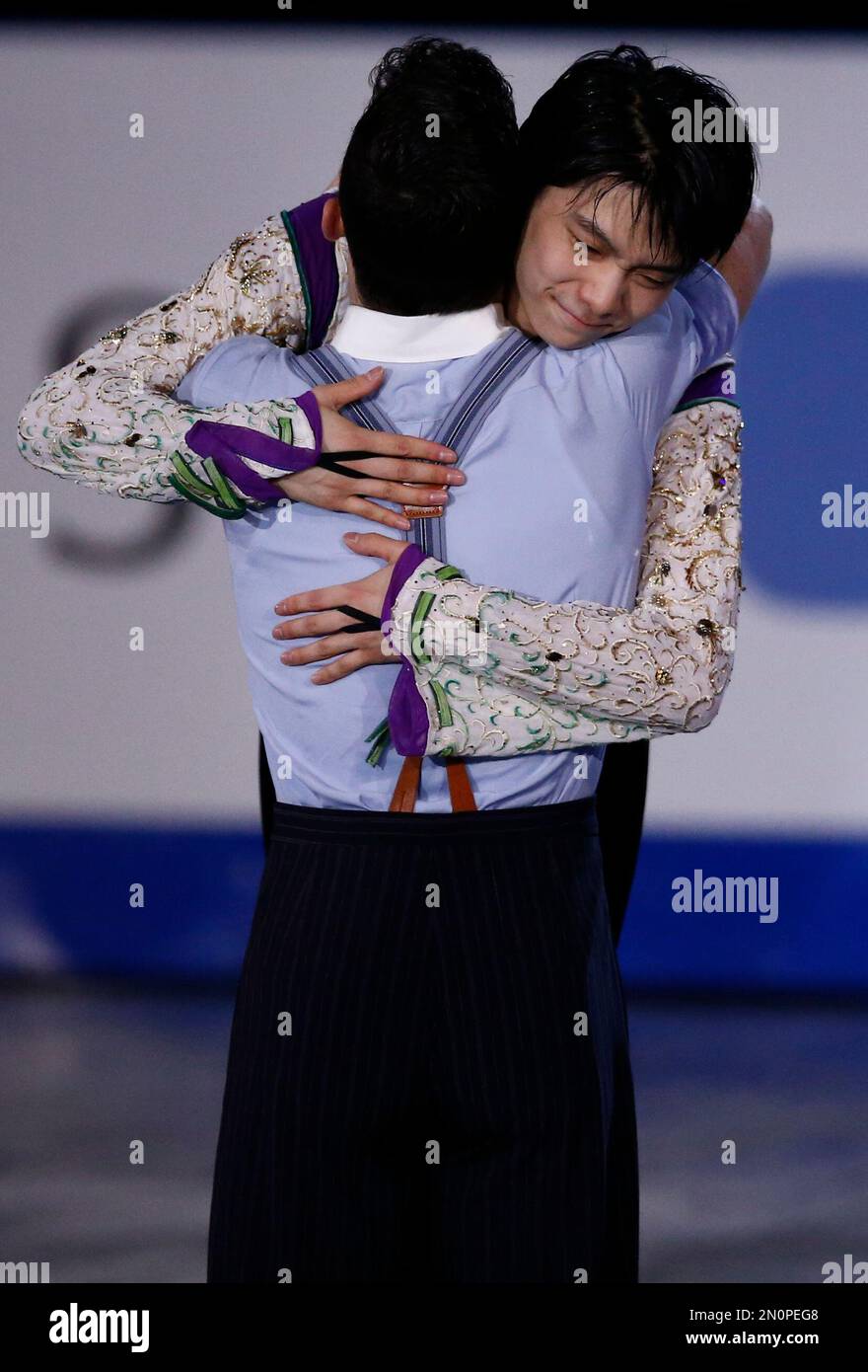 Gold medal winner Yuzuru Hanyu of Japan, right, hugs silver medal