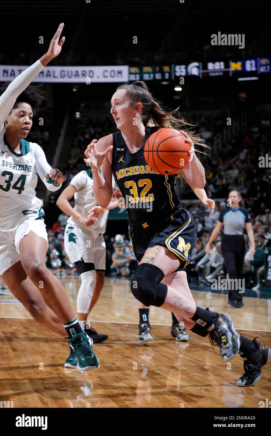 Michigan's Leigha Brown, right, drives against Michigan State's Isaline