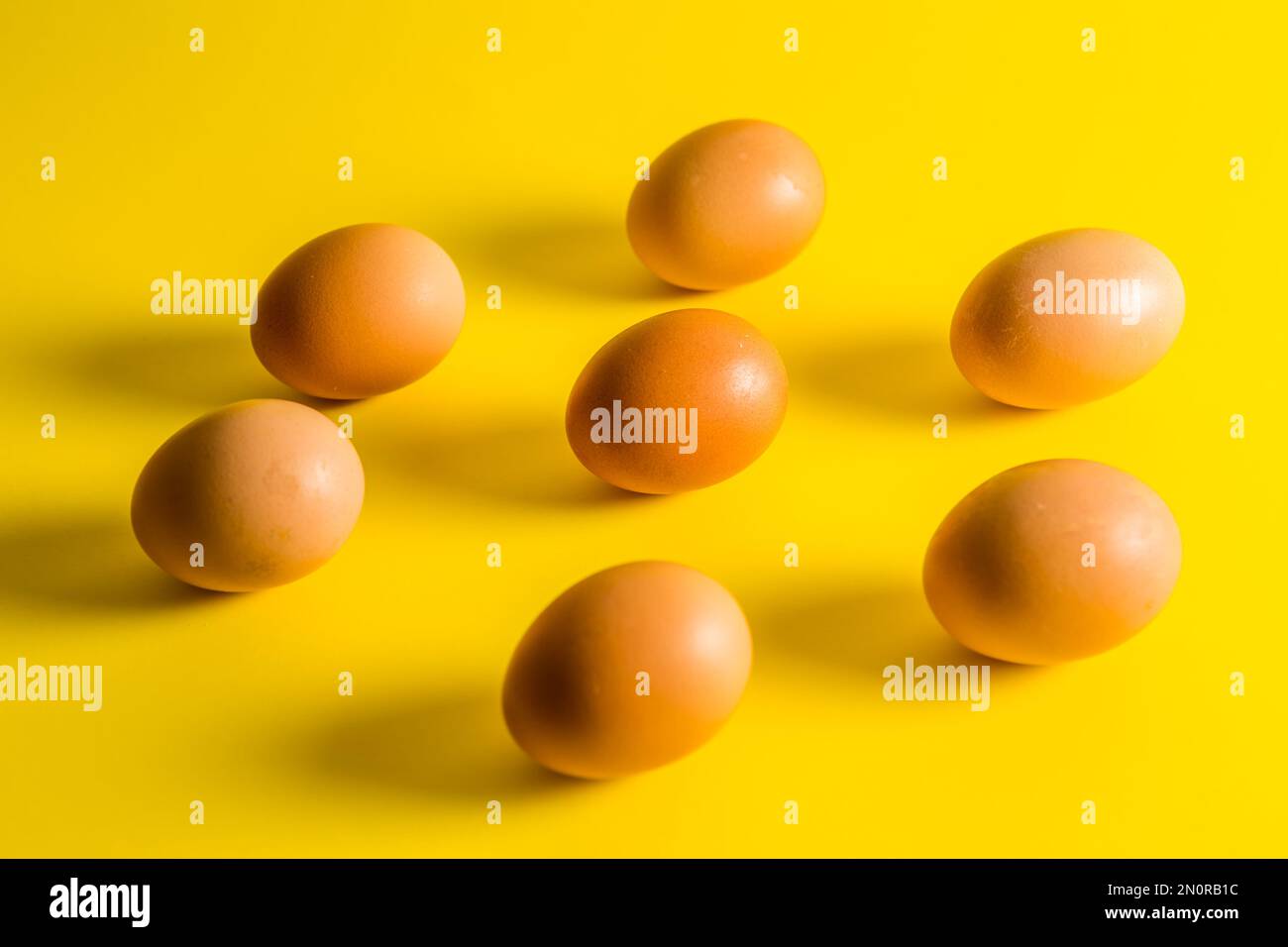 Eggs on a yellow background Stock Photo