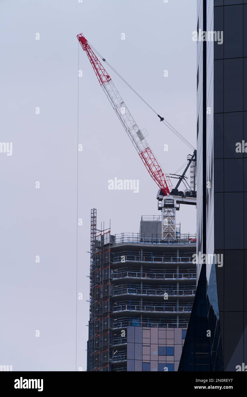 Construction crane on a building site lifting equipment in Melbourne