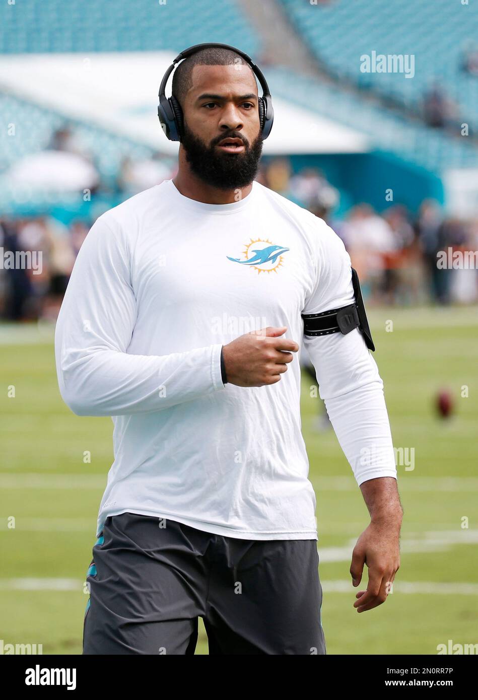 Miami Dolphins linebacker Spencer Paysinger (42) warms up before an NFL