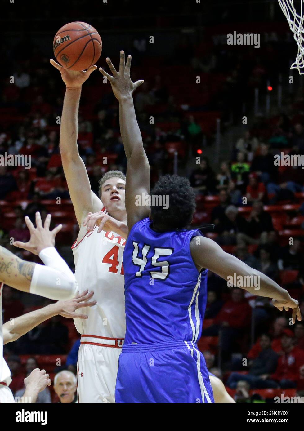 Utah forward Jakob Poeltl (42) shoots as IPFW's Brent Calhoun (45